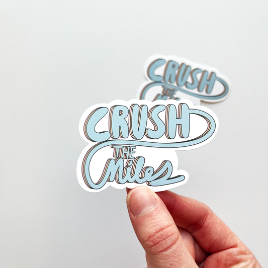 Crush the miles sticker with blue text. The text repeats to make an outline behind in colors of yellow and then pink