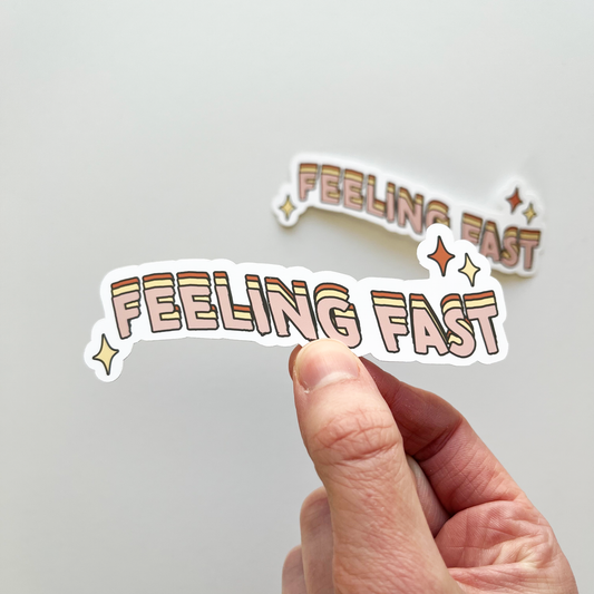 Feeling fast sticker in pink, yellow, and dark pink