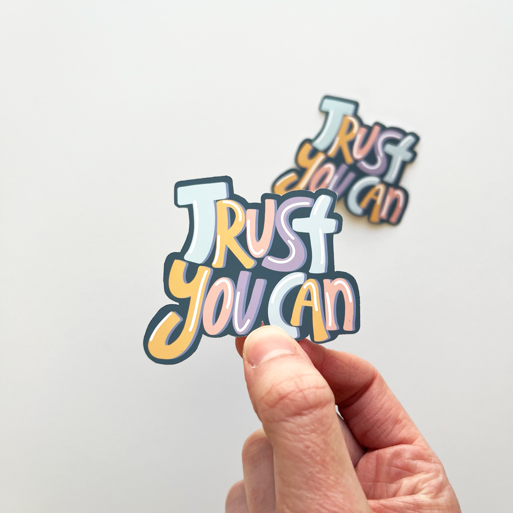 Trust you can sticker with alternating colors on each letter of blue, yellow, pink, purple