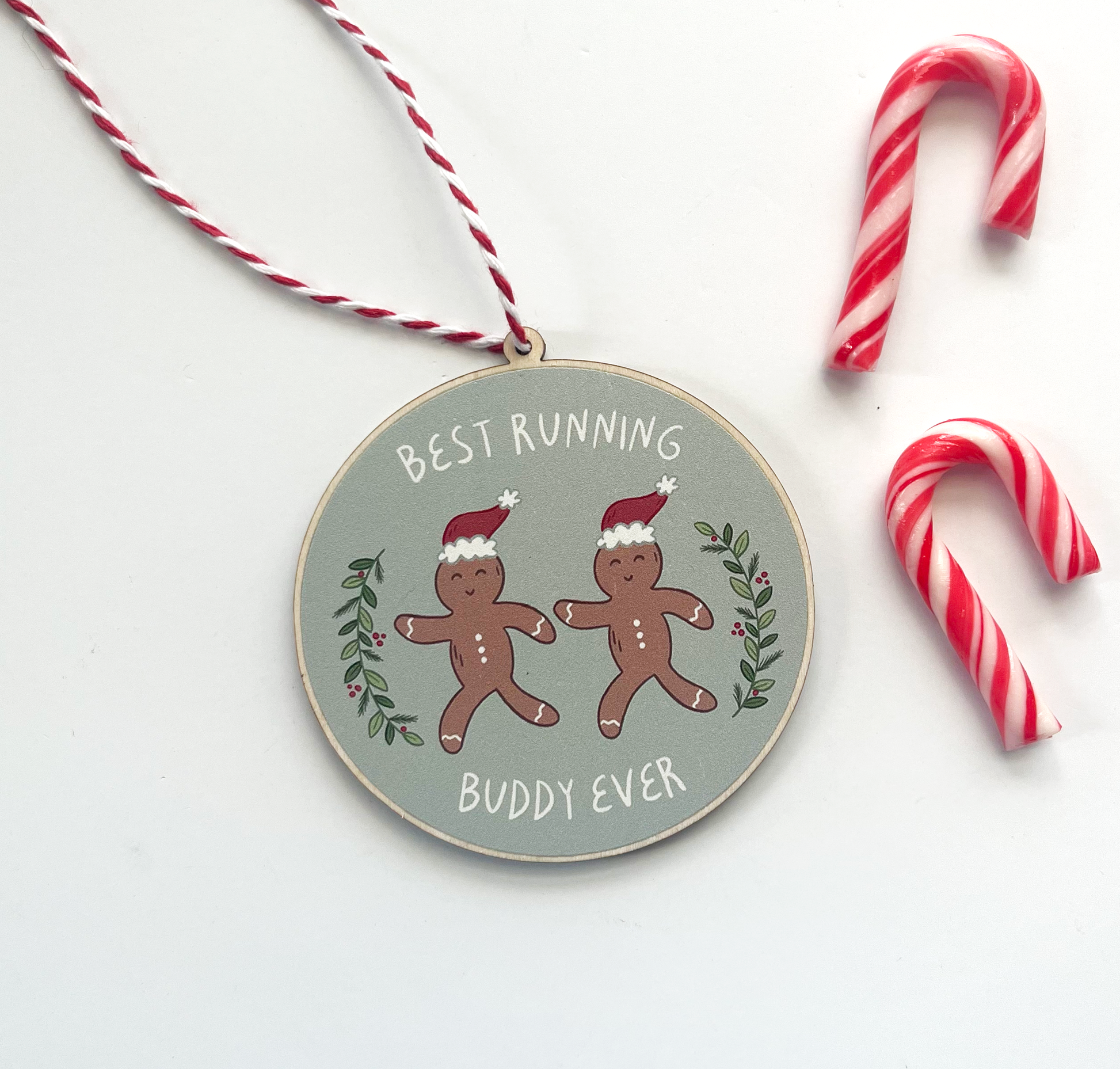 Running buddy ornament with candy canes