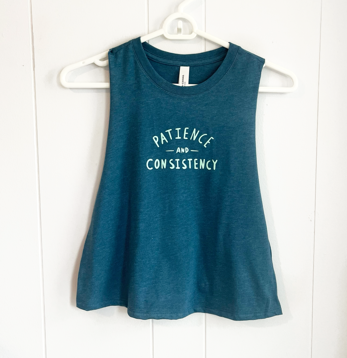 patience and consistency tank top in blue with teal lettering